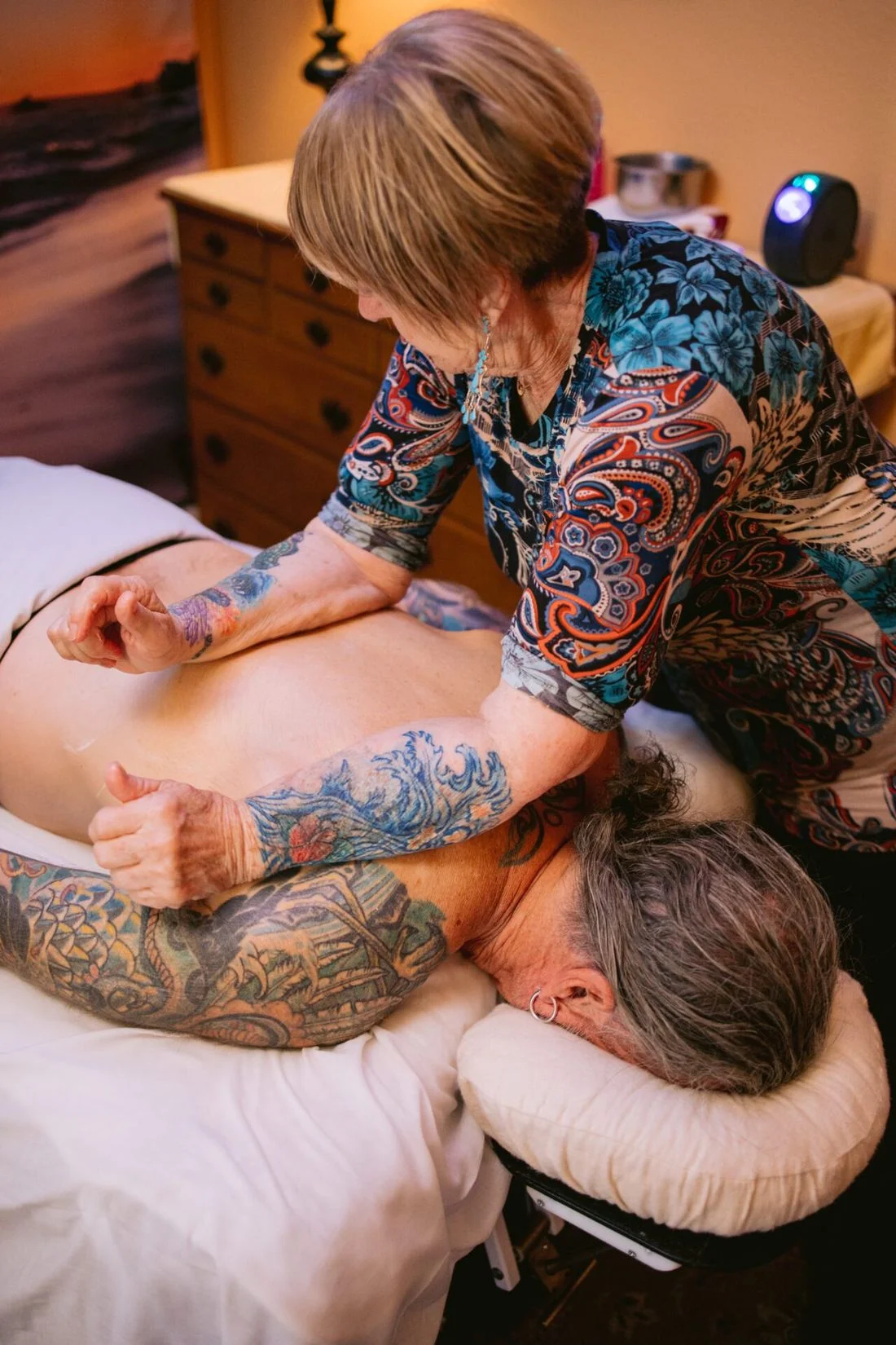 Maggie providing hands-on massage with her forearms